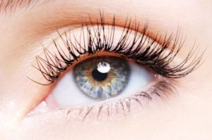 5859098 - woman eye with a curl false eyelashes - low angle view